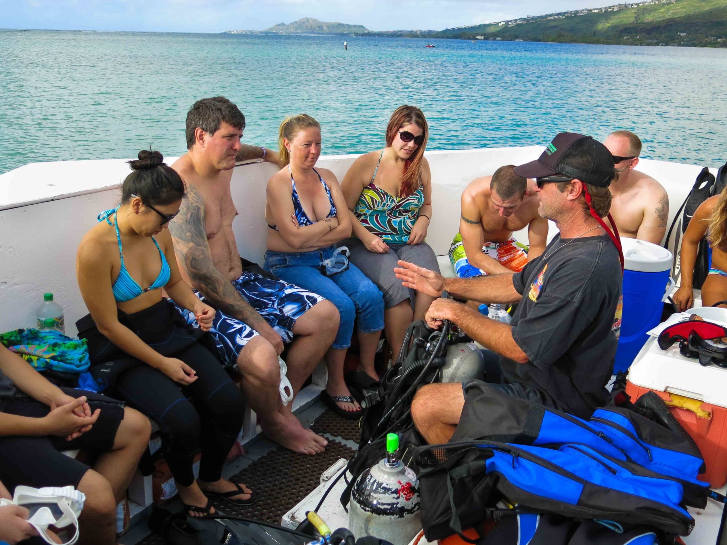 Rebecca Steinfeld et al. sitting next to a body of water