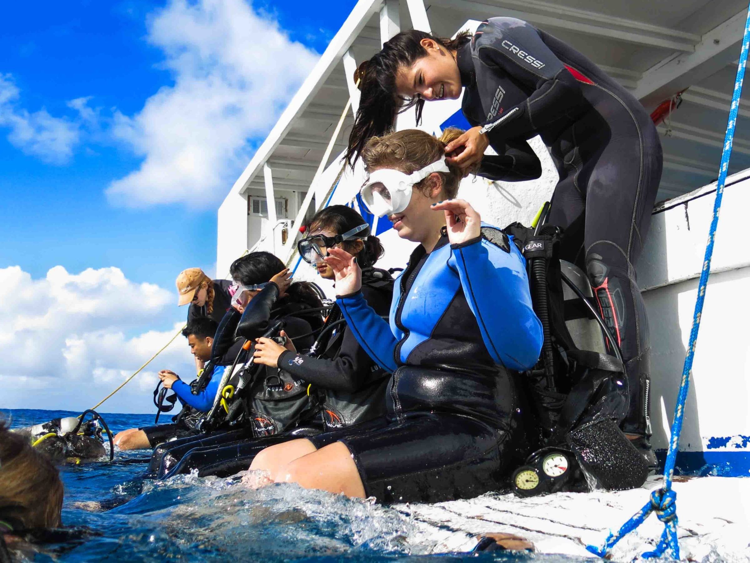 a group of people riding skis on top of a snow covered slope
